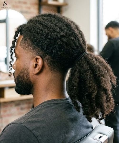 31. Low Taper Fade for Coily Long Hair