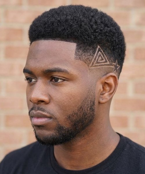 Mid Taper Fade with Designs and Artistic Details